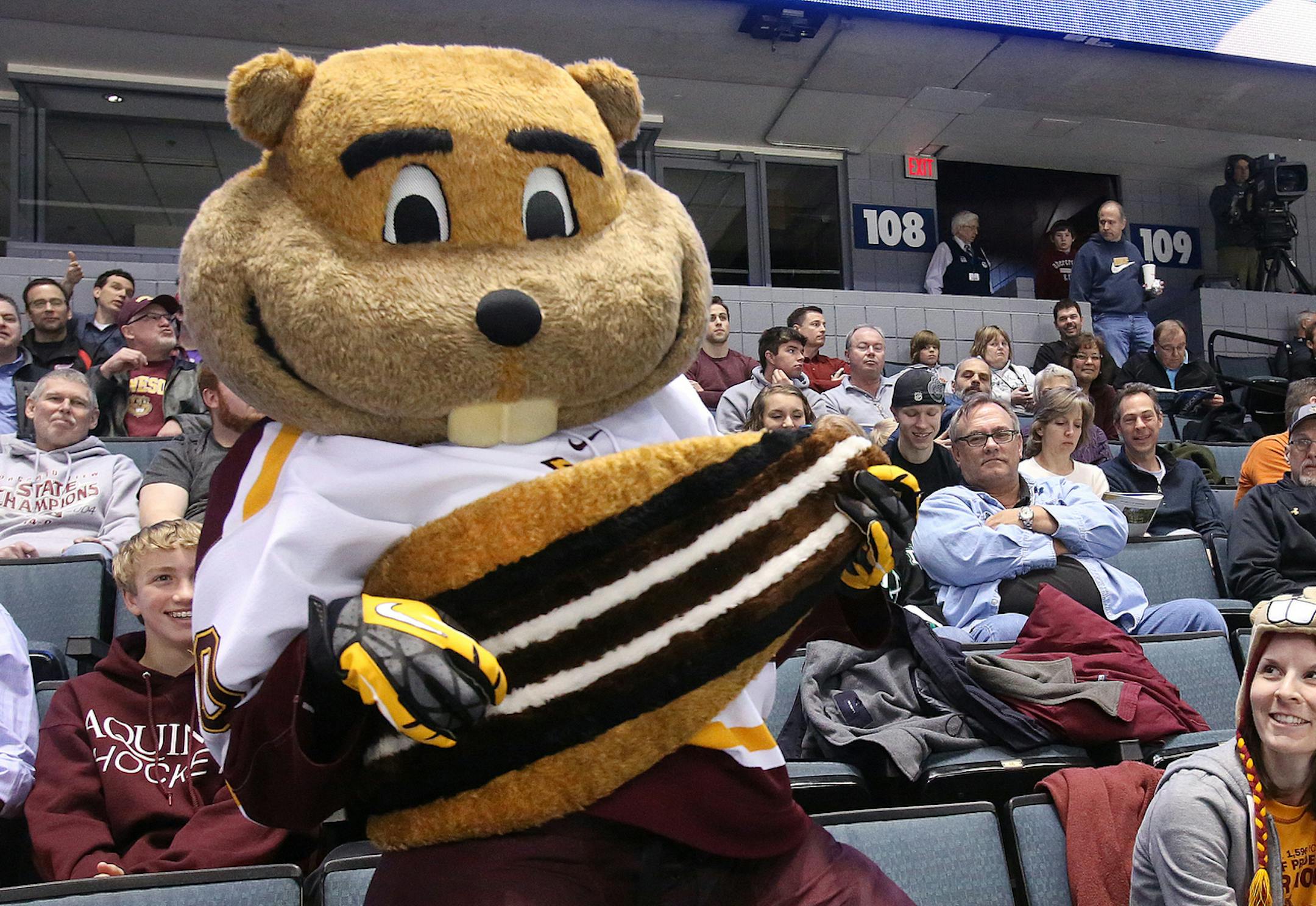 Minnesota Golden Gopher mascot,Goldy, works the stands during the Western Regional semi-final at the Van Andel Arena in Grand Rapids. ( Rex Larsen photo ) ORG XMIT: MIN1303291834362872