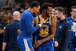 Golden State Warriors forward Andrew Wiggins (22) celebrates with forward Otto Porter Jr. (32) as time winds down in Game 6.