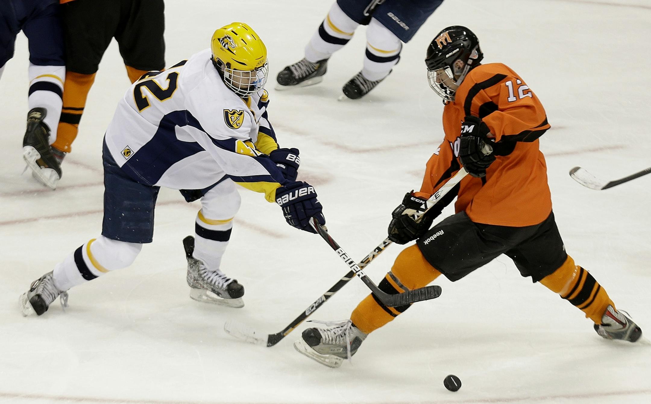 Breck's Michael Orke, left, and Marshall's Randy Louwagie battled for the puck during the third period during the Class 1A boys' hockey state tournament quarterfinals at the Xcel Energy Center, Wednesday, March 6, 2013 in St. Paul, MN.(ELIZABETH FLORES/STAR TRIBUNE) ELIZABETH FLORES � eflores@startribune.com