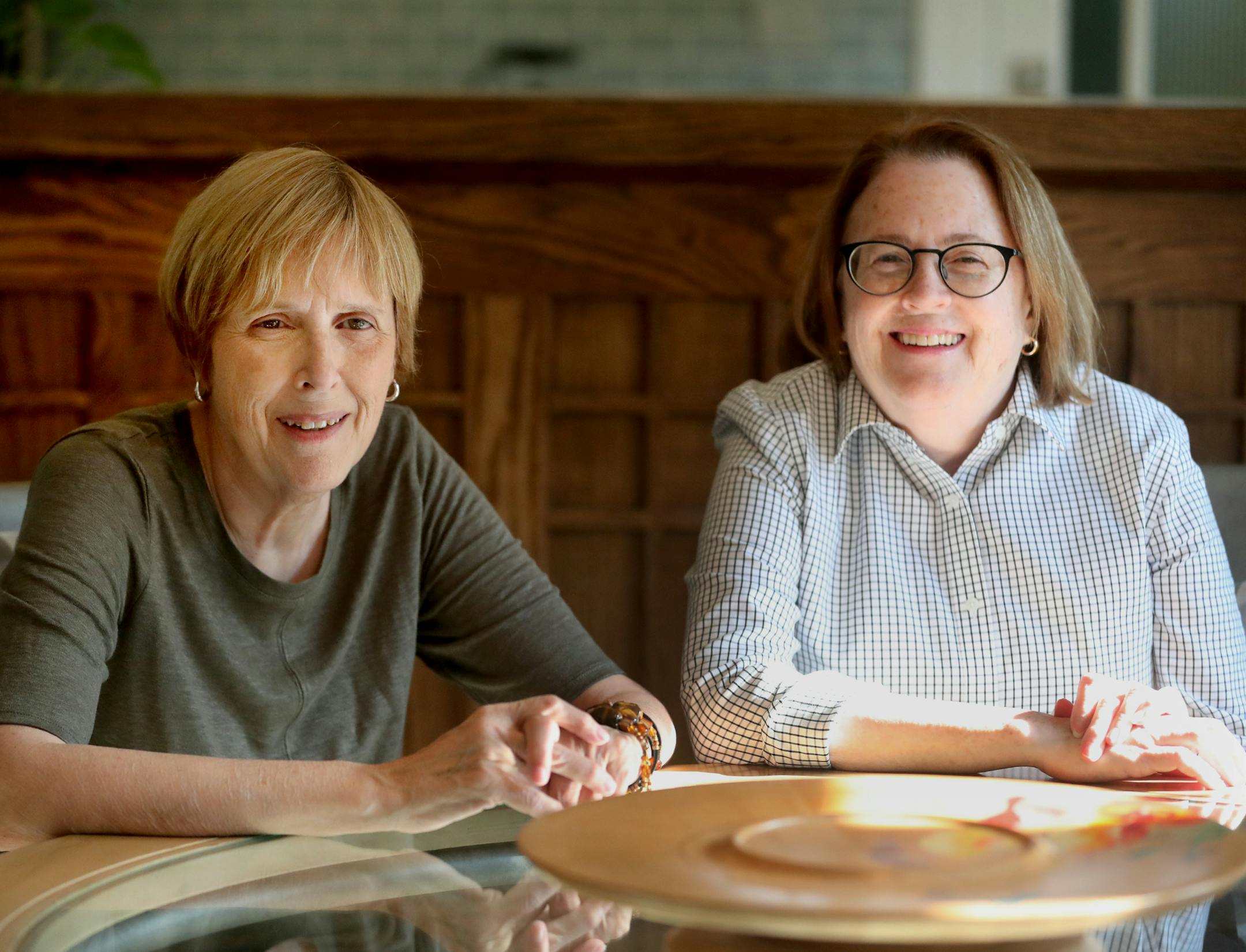 Sisters Susan, left, and Peggy McKevitt renovated both their kitchens in their St. Paul duplex at the same time.