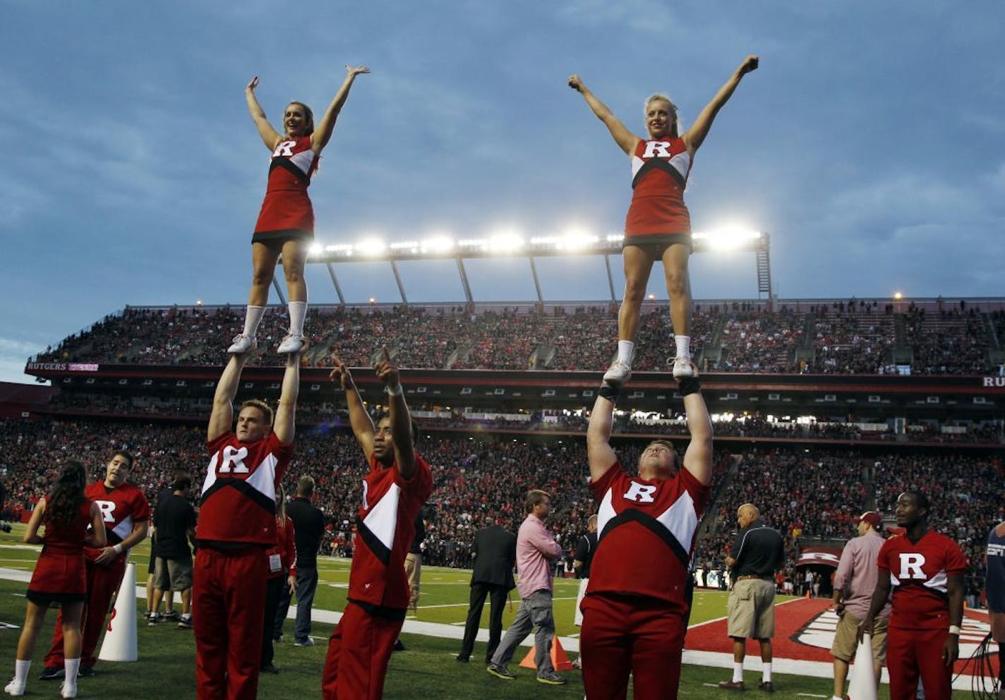 Rutgers cheerleaders celebrate near the end of the second half of an NCAA college football game against Arkansas in Piscataway, N.J., Saturday, Sept. 21, 2013. Rutgers won 28-24.