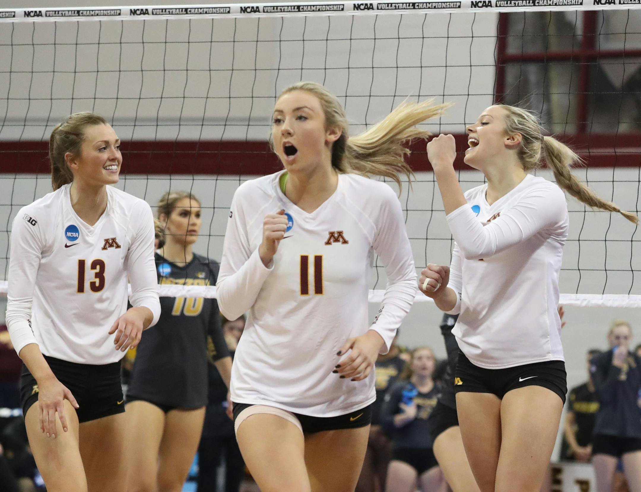 The University of Minnesota's Molly Lohman (13), Samantha Seliger-Swenson (11) and Paige Tapp (4) celebrate a point against the University of Missouri during the 3rd set of Minnesota's 3 sets to 1 victory over the University of Missouri during the regional NCAA volleyball tournament Friday, Dec. 8, 2016, at the Sports Pavilion in Minneapolis, MN.]
(DAVID JOLES/STARTRIBUNE)djoles@startribune.com The University of Missouri at the University of Minnesota in the regional NCAA volleyball tournament F
