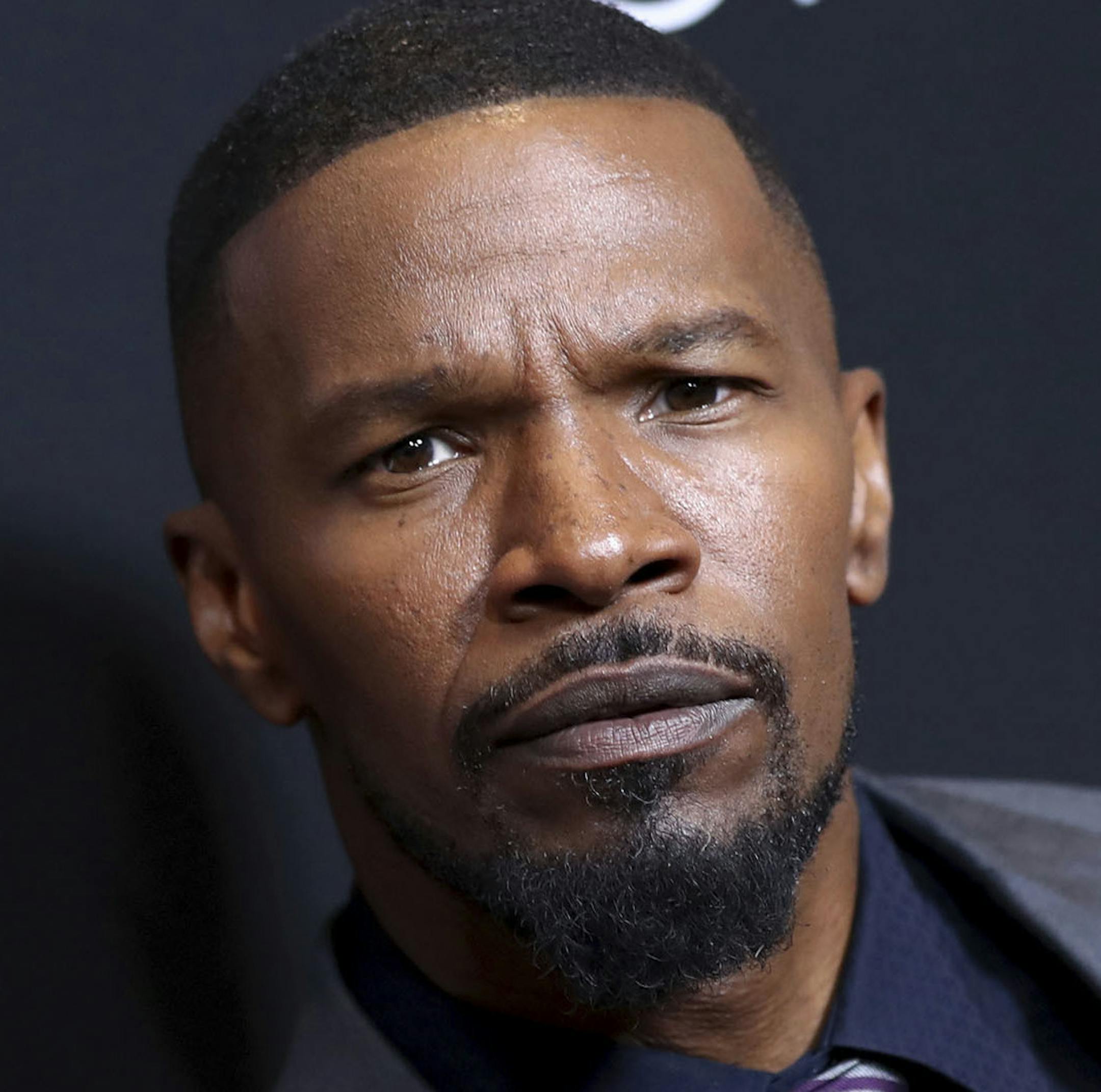 FILE - This Jan. 5, 2017, file photo shows Jamie Foxx at the premiere of "Sleepless," in Los Angeles. The Oscar-winning actor will host Fox TVís ìBeat Shazam,î an interactive game show based on the song-identification app Shazam. The game showís producers include Mark Burnett of ìSurvivorî and ìThe Voice.î (Photo by John Salangsang/Invision/AP, File)