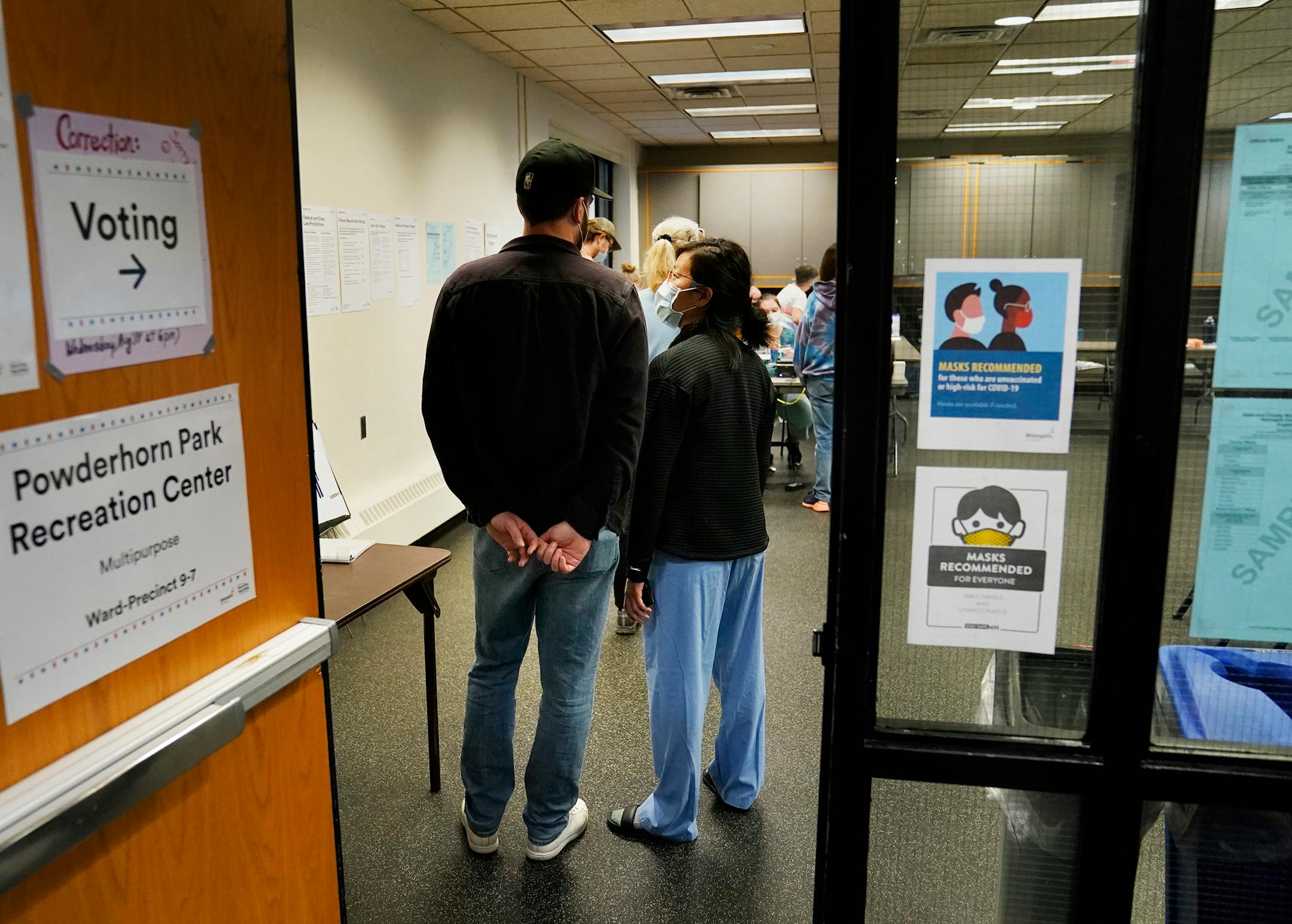 Voters wait in line at Powderhorn Park during the primary election that includes the 5th congressional district in Minneapolis.