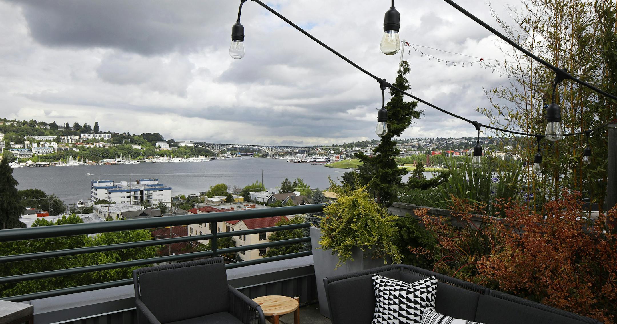 The top deck of Max Lemman's Eastlake
condo, perfect for brunch, barbecues and a little awe on the horizon, sticks with the black-and-white theme. "Holidays are the best here," he says. "The Christmas boat parade, Fourth of July fireworks - the two best holidays, and you've got the best views for them. What's really fun during the summer is the Duck Dodge. I'll sit on the balcony and open a beer and watch sailboats race around the lake." (Ken Lambert/The Seattle Times/TNS)