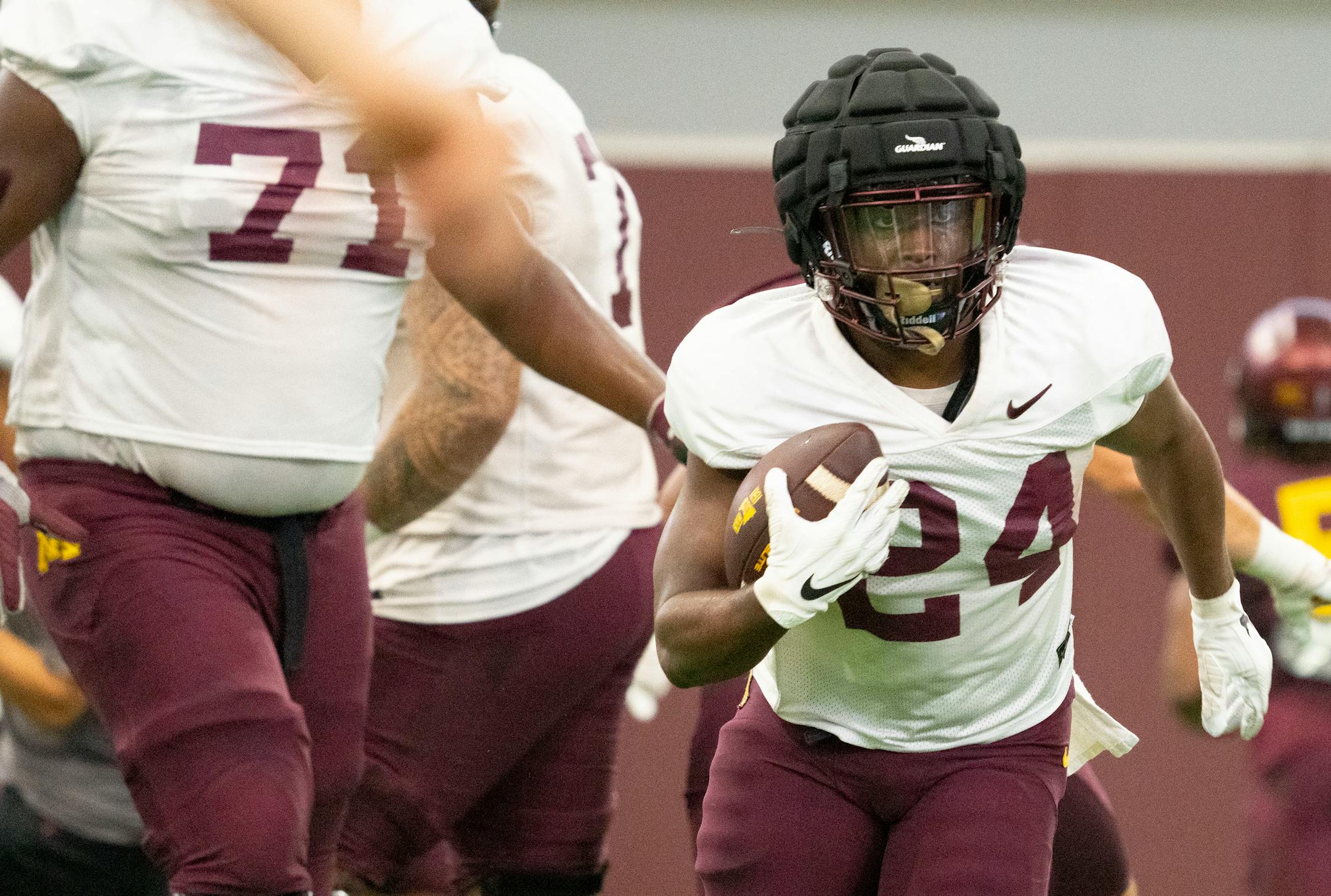 Gophers running back Mohamed Ibrahim (24) runs with the ball during the football team's open practice Saturday.