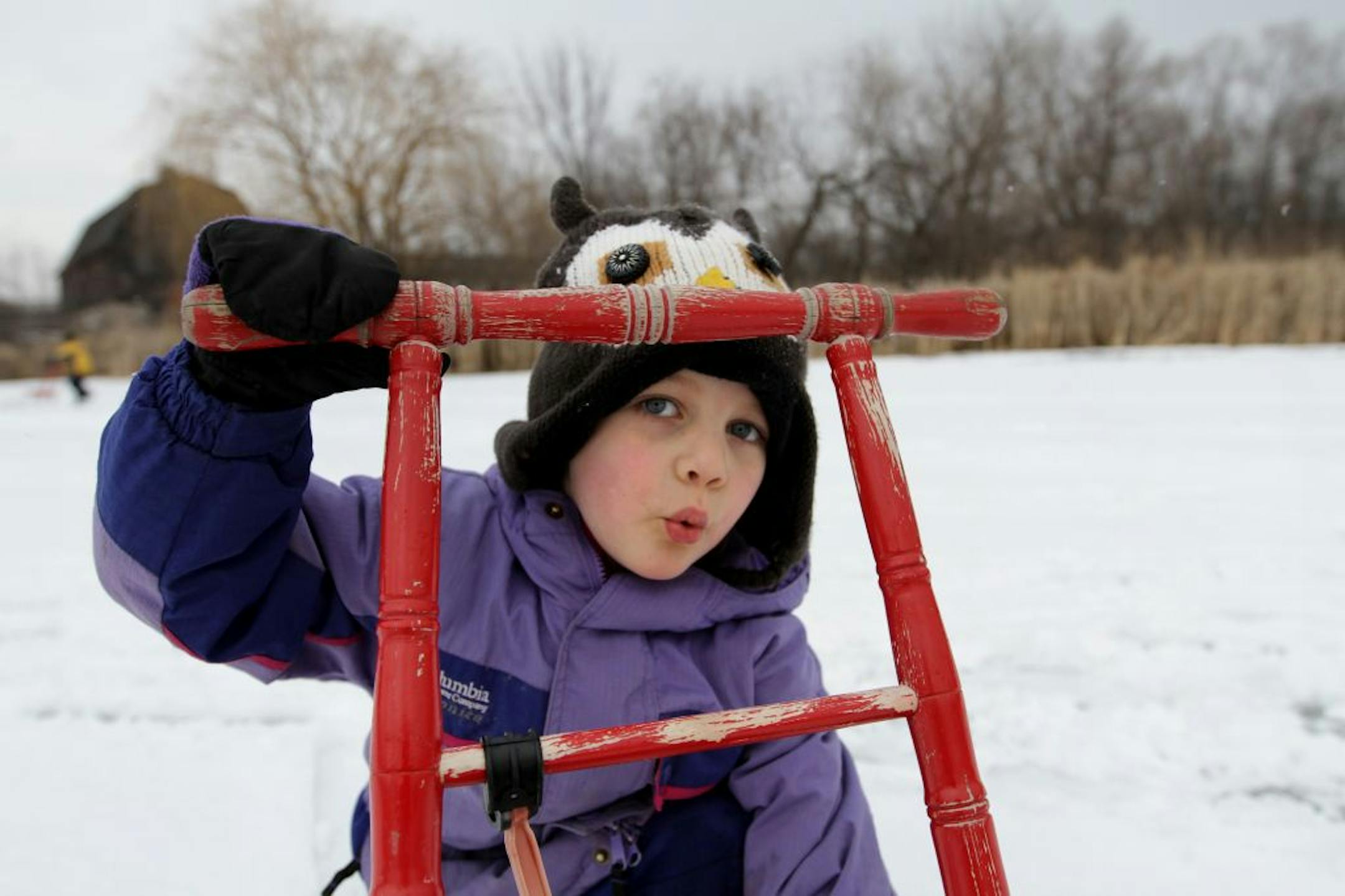 Harper Lostetter (4 years old, cq/teacher) hooted like an owl while playing with a kicksled on Wednesday February 15, 2012 at the Dodge Nature Center. The pre-school class has a special interest in owls and usually spots one when out on walks around the center's land.