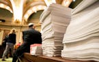 A huge stack of amendments for the HHS bill were stacked in the House Chamber at the start of Thursday's session. ] GLEN STUBBE &#x2022; glen.stubbe@s