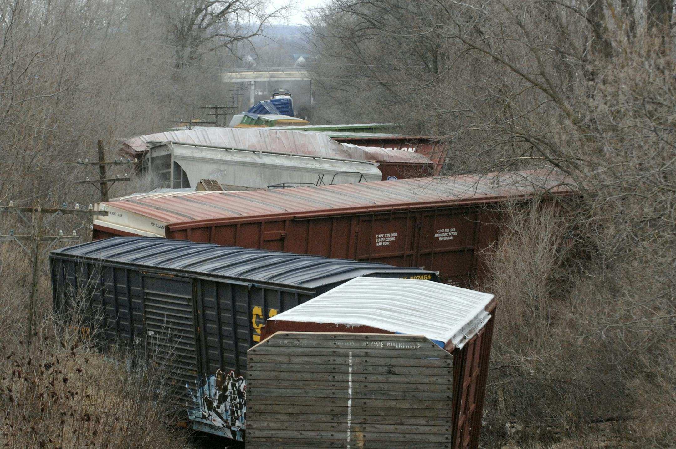 Train cars lay jack knifed west of Minnesota Highway 3 after 28 cars derailed early Monday, March 31, 2008, in Northfield, Minn. The Union Pacific freight train derailed around 2 a.m. Monday, causing a sulfuric acid leak from one of the cars.