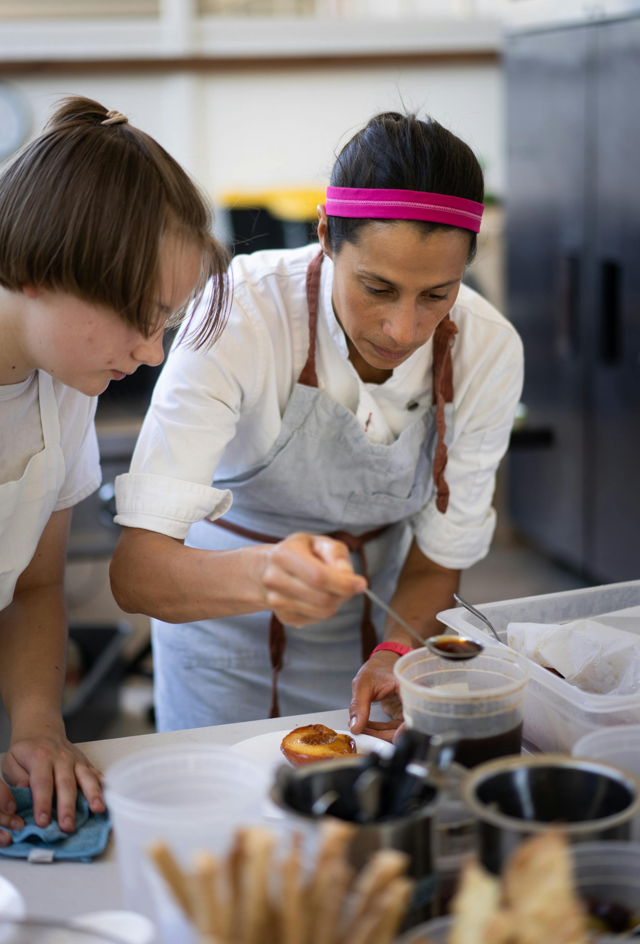 Chef Jo Seddon demonstrates how to assemble a dessert.