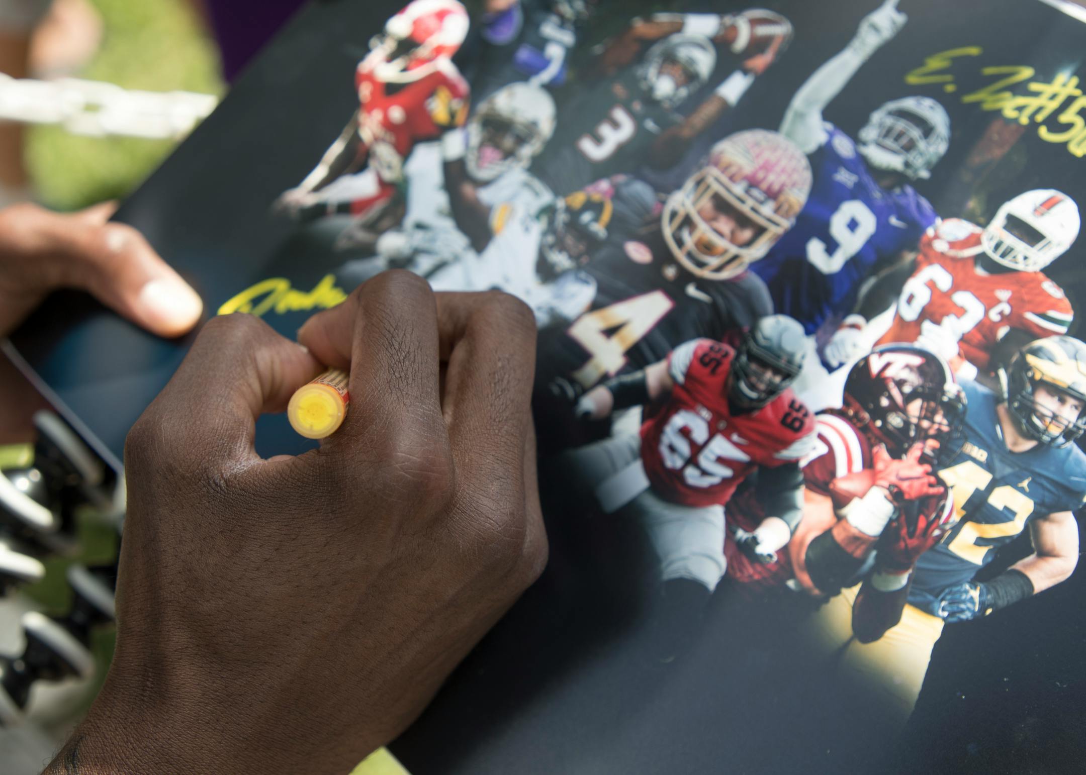 Rodney Adams autographed a photo for a fan after rookies and select players arrived at Vikings training camp at Minnesota State University Mankato Sunday July 23, 2017 in Mankato, MN. ] JERRY HOLT � jerry.holt@startribune.com