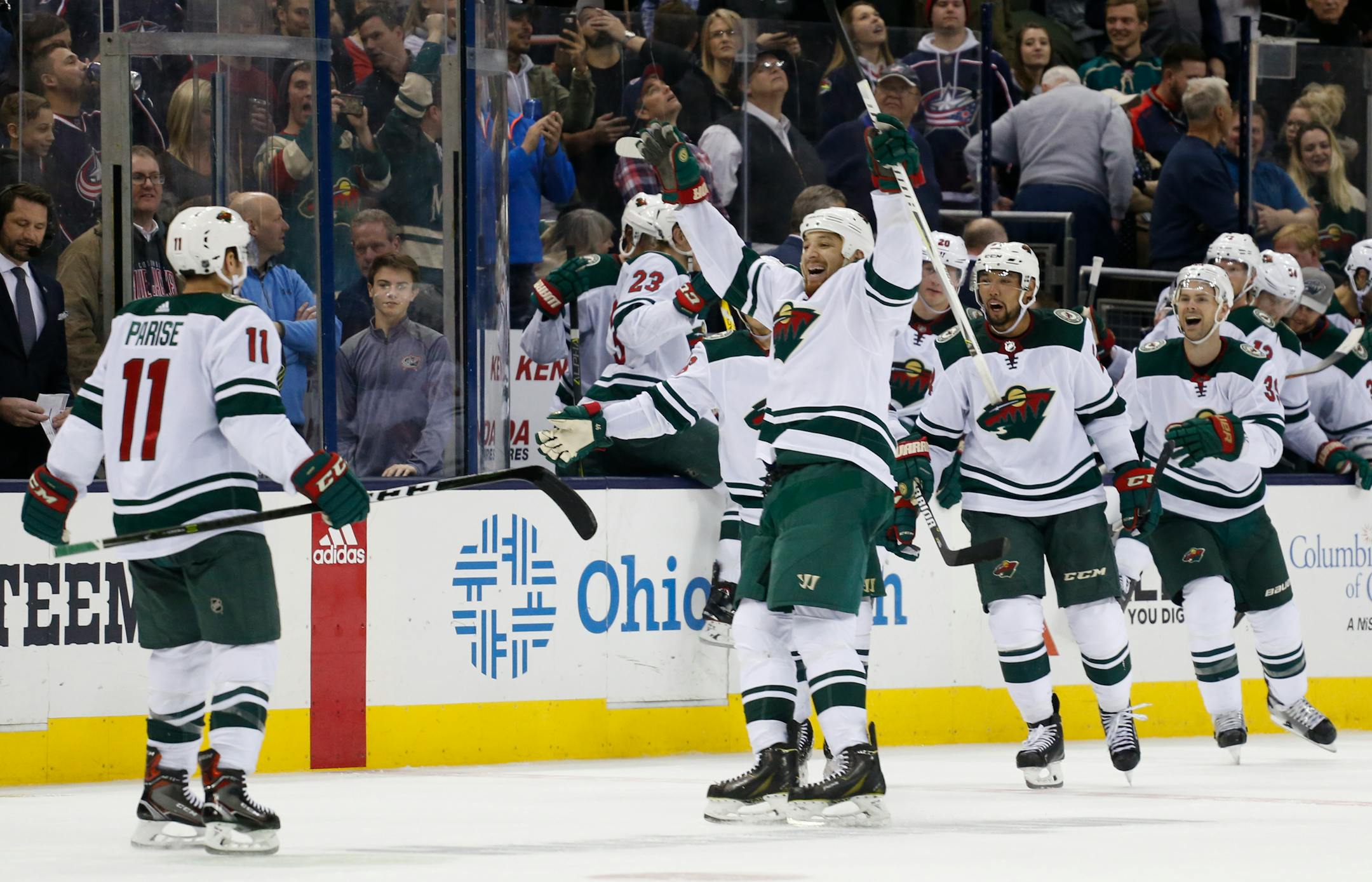 Minnesota Wild players celebrate their win over the Columbus Blue Jackets in an NHL hockey game Tuesday, Jan. 30, 2018, in Columbus, Ohio. The Wild beat the Blue Jackets 3-2 in a shootout. (AP Photo/Jay LaPrete)