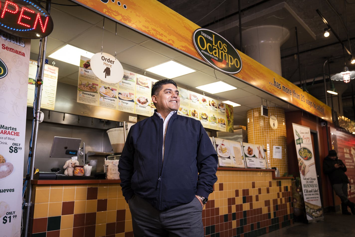 Armando Ocampo posed for a portrait inside the Los Ocampo location inside Midtown Global Market in Minneapolis. ] LEILA NAVIDI &#x2022; leila.navidi@startribune.com BACKGROUND INFORMATION: John Wolf, the owner of Chicago-Lake Liquors, posed for a portrait with restaurateur Armando Ocampo, who will be the flagship retail tenant on ground floor of the apartment building Wolf is building on the corner of Lake Street and Chicago Avenue in Minneapolis on December 11, 2019.