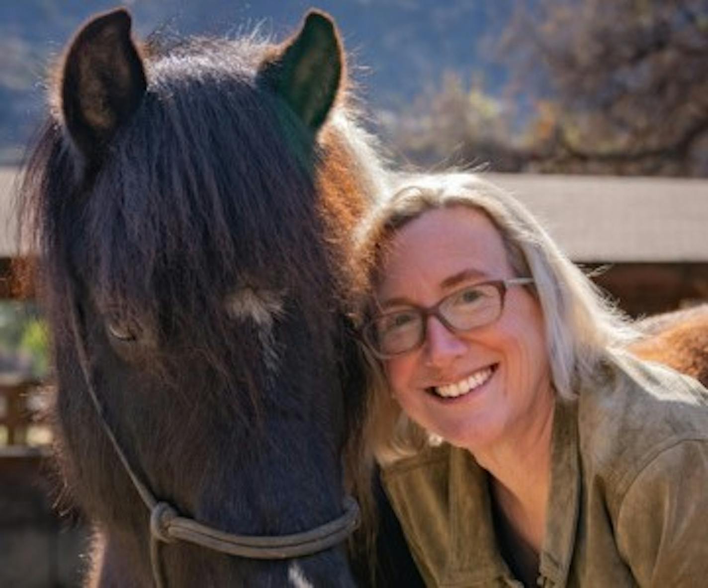 photo of author Christina Lynch with a pony