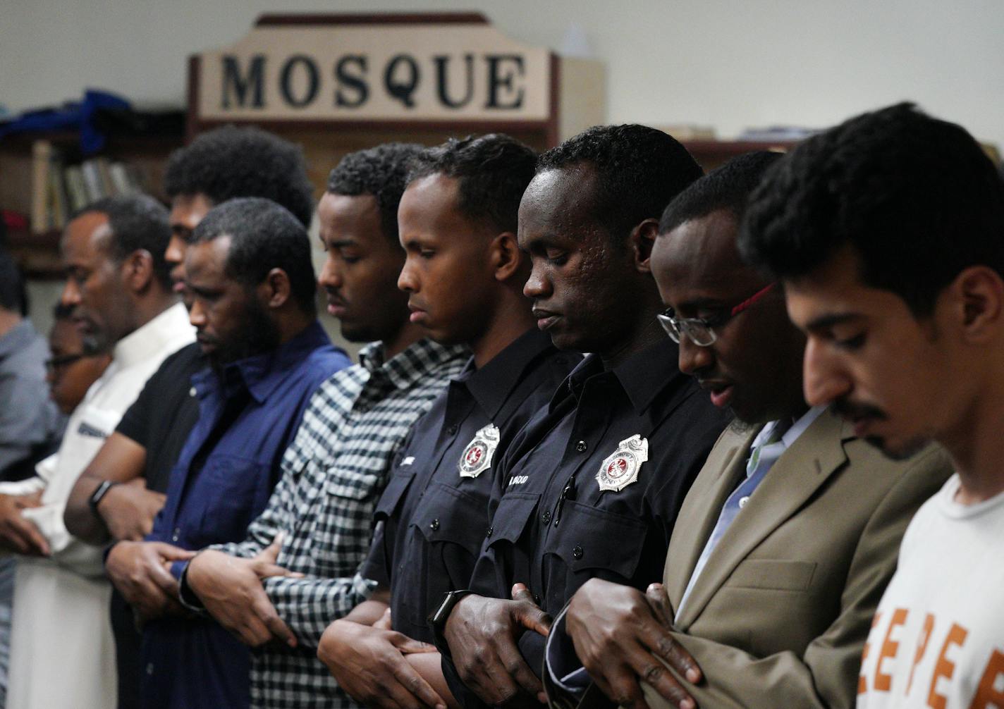 Abdi Warsame and Mohamed Daoud, two newly sworn in Somali American firefighters with the St. Paul Fire Department, prayed with worshipers at the Islamic Dawah Center as part of their community outreach. ] ANTHONY SOUFFLE &#x2022; anthony.souffle@startribune.com Abdi Warsame and Mohamed Daoud, two newly sworn in Somali American firefighters with the St. Paul Fire Department, did outreach in uniform at the Islamic Dawah Center Friday, July 5, 2019 in St. Paul.