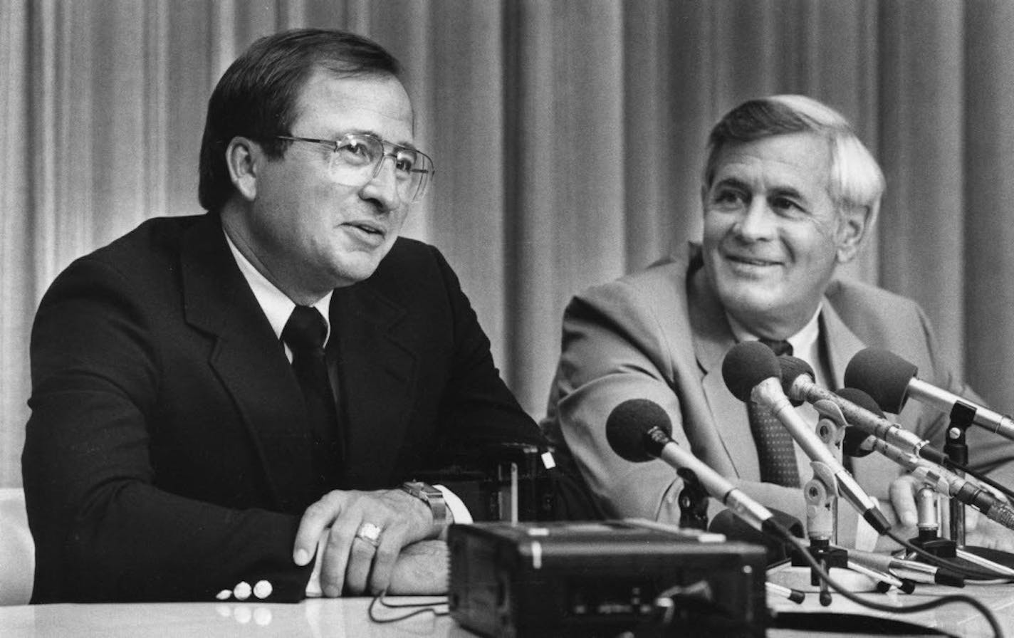 University of Minnesota hockey coach Doug Woog, left, and Athletic Director Paul Giel, right, at the 1985 news conference announcing Woog's appointment.