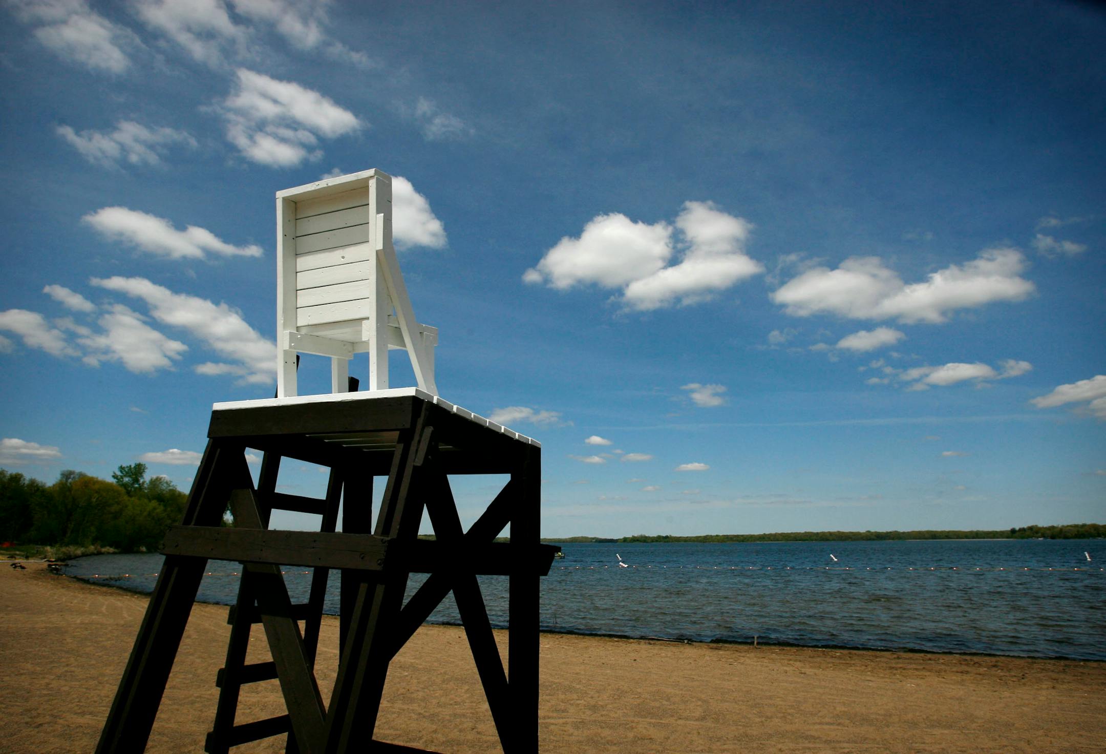 DAVID JOLES � djoles@startribune.comWashington, County, MN - May 23, 2008 - An empty lifeguard's chair and beach will not remain empty for long at Big Marine Park Reserve. A grand opening ceremony will be held June 7 to herald a 350 foot long swimming beach with a boat launch onto Big Marine Lake -- one of the metro area's bet recreational lakes.