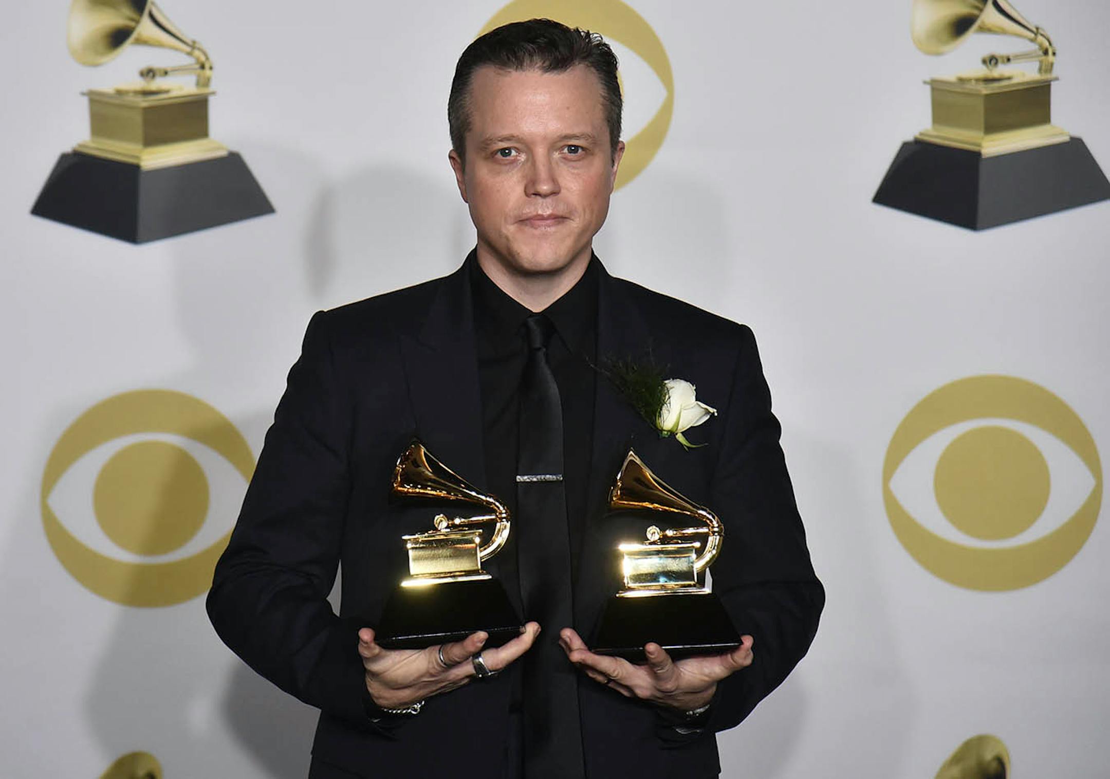 Jason Isbell poses in the press room with the best American roots song award for "If We Were Vampires" and the best Americana album award for "The Nashville Sound" at the 60th annual Grammy Awards at Madison Square Garden on Sunday, Jan. 28, 2018, in New York.