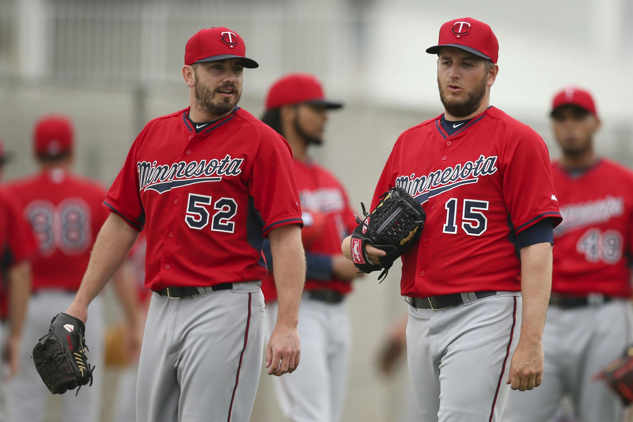 Twins pitchers Brian Duensing (52) and Glen Perkins (15) walked to the bullpen after stretching last Wednesday morning at Hammond Stadium. ] JEFF WHEELER ï jeff.wheeler@startribune.com Twins pitchers and catchers continued their workouts Wednesday morning, February 25, 2015 at Hammond Stadium in Fort Myers, FL. ORG XMIT: MIN1503031723590529