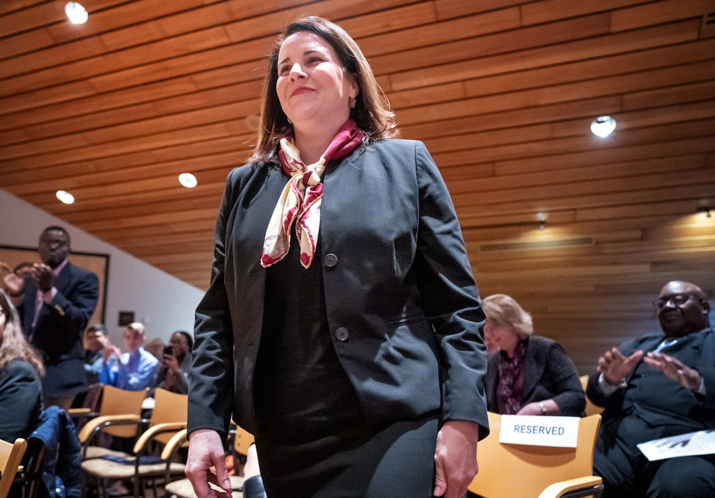 Joan Gabel rose to greet members of the Board of Regents after they unanimously voted to hire her as the university's first female president.