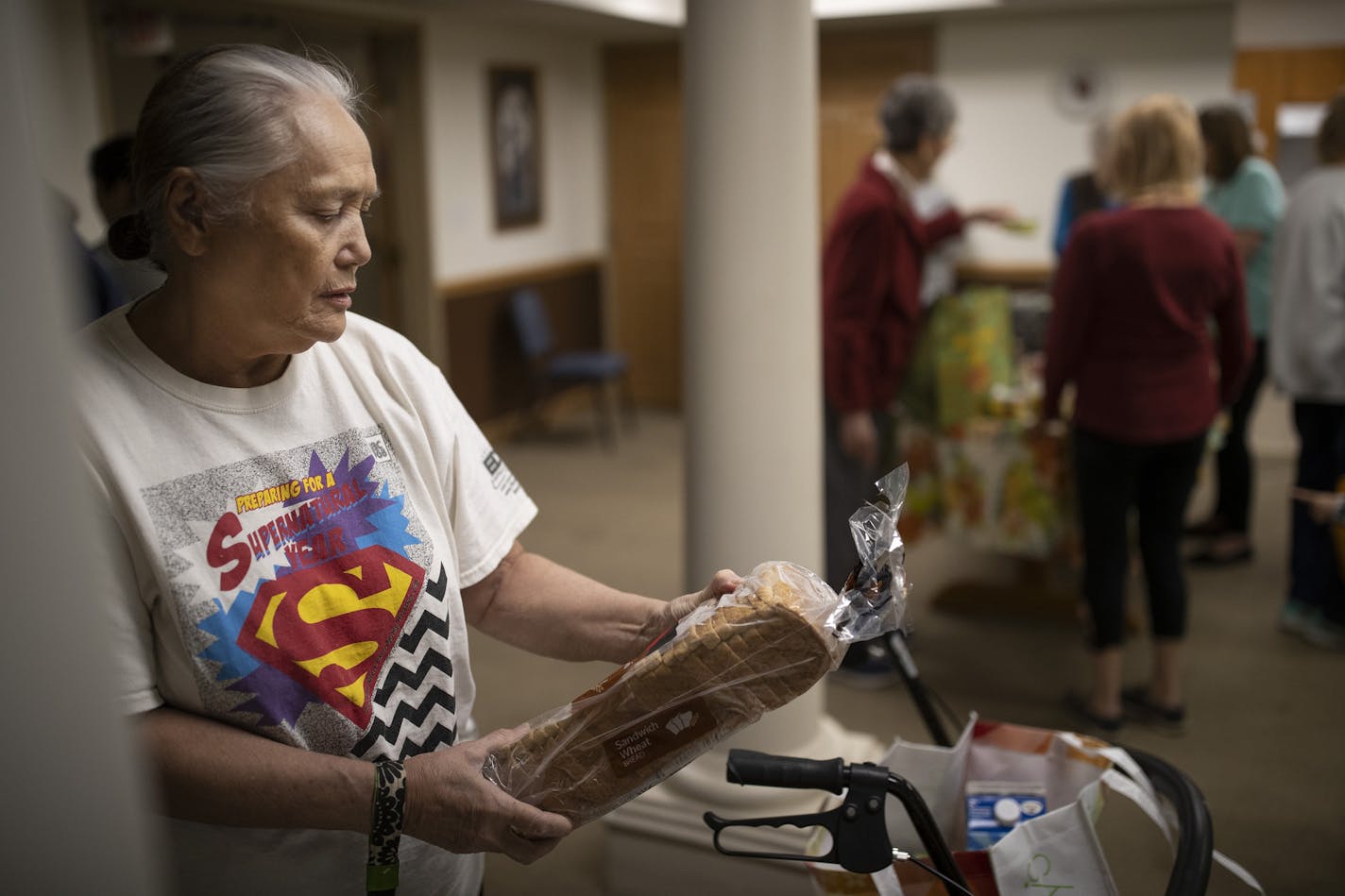 Patty Sachs 82, pick up a loaf of bread at the Bassett Creek Commons food pantry. The food is given to seniors by the East Side Neighborhood Services mobile food shelf.] Jerry Holt &#x2022; Jerry.holt@startribune.com Half a dozen Twin Cities nonprofits that provide free food to low-income seniors say they will have to drastically cut back services if Hennepin County approves a $1 million cut in their funding. They say the county is shifting resources to child protection and cutting funding for f