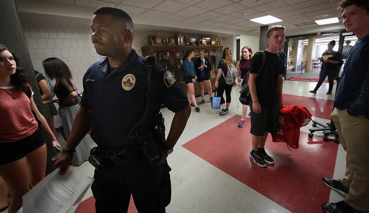 Cortez Hull, school resource officer (SRO) at Highland Park High School in St. Paul, monitored the hallways as classes let out for the day. ] JIM GEHRZ &#xef; james.gehrz@startribune.com / St. Paul, MN / June 8, 2016 3:00 PM &#xf1; BACKGROUND INFORMATION: Recent events have brought sharp contrasts in how school resource officers -- cops in the schools -- are viewed locally, and their future in two of the state's largest districts is a matter now up for debate. In St. Paul, district leaders honor