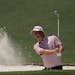 Tom Hoge hits out of a bunker on the second hole during a practice round at Augusta National Golf Club on Monday. 