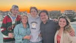Isaac Schuman, center, with family members, from left, brother Jake Schuman, mother Alina Hernandez, father Donny Hernandez and sister Alexis Hernande