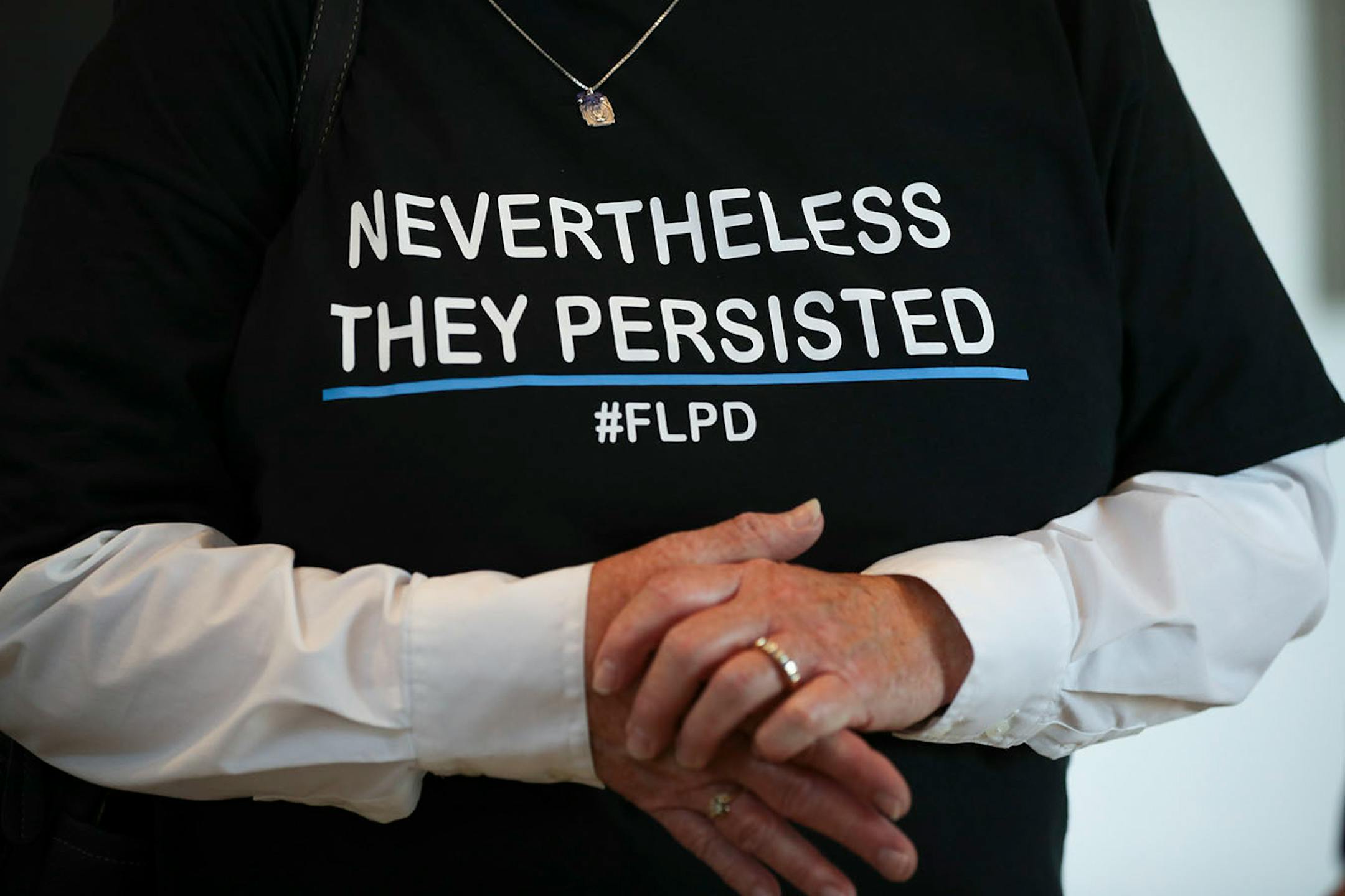 Friends of the Forest Lake Police Department wore t-shirts to the city council meeting to demonstrate their support.