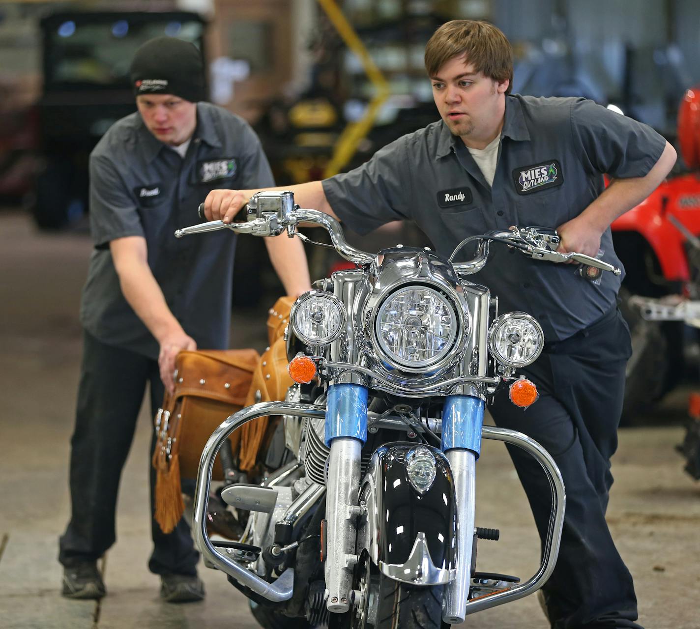 (left to right) Mies Outland motorcycle technicians Brent Bachman and Randy Reiter uncrated an Indian Vintage motorcycle at the Watkins MN., dealership on 1/31/14.] Bruce Bisping/Star Tribune bbisping@startribune.com Brent Bachman, Randy Reiter/source.