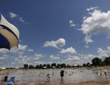 At the Lake Elmo Park Preserve swimming beach, hundreds of people enjoyed the weather on Memorial day .] rtsong-taatarii@startribune.com, ORG XMIT: MI