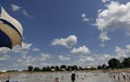At the Lake Elmo Park Preserve swimming beach, hundreds of people enjoyed the weather on Memorial day .] rtsong-taatarii@startribune.com, ORG XMIT: MI