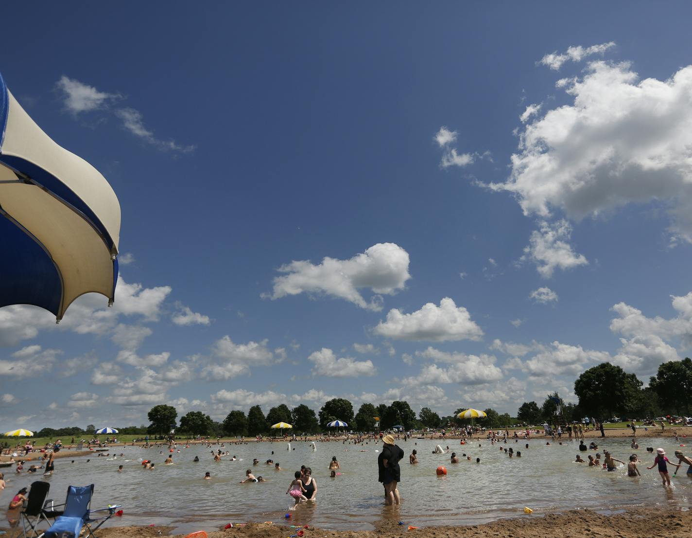 At the Lake Elmo Park Preserve swimming beach, hundreds of people enjoyed the weather on Memorial day .] rtsong-taatarii@startribune.com, ORG XMIT: MIN2012103110273440