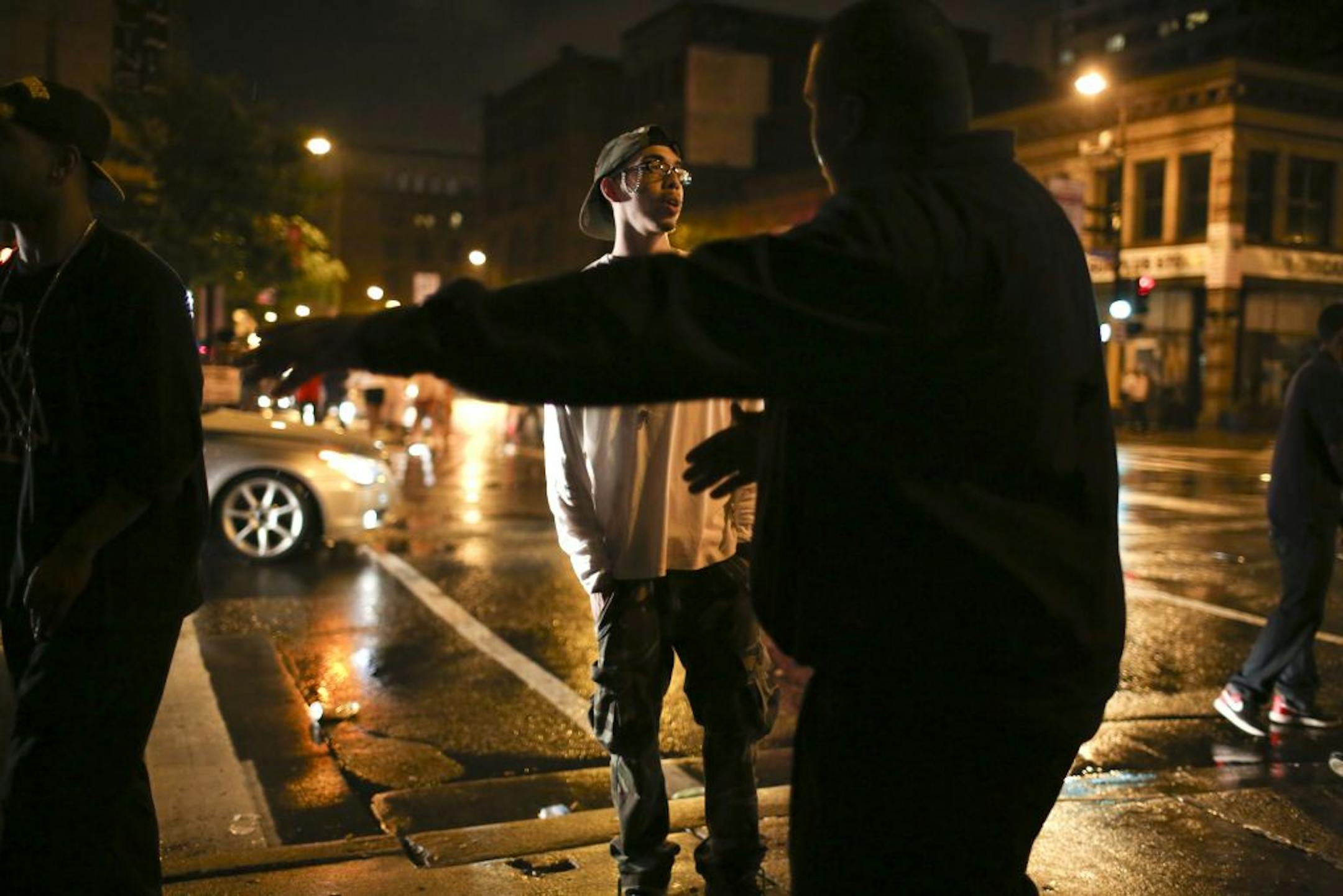 Minneapolis Police are saying that the crowds early Monday morning when the bars close at 2 a.m. are increasingly a problem at the intersection of First Ave. N. and 4th St. N. The scene outside Club Envy shortly after 2 a.m. Monday morning, May 28, 2012 as a security guard encouraged club goers to disperse into the rainy night.