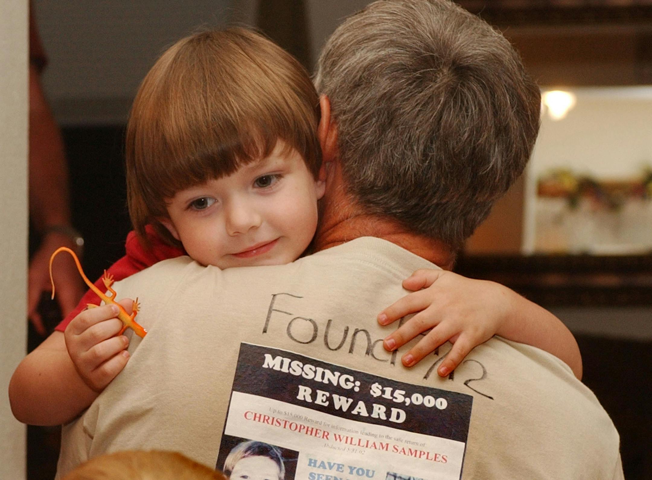 Friday, Sept. 12, 2003. Stockholm, WI. Chris Samples with grandfather Bill Bjork (w/"Reward T-Shirt") after being reunited in Pepin, WI. (By Durk Stark Courtesy of the Bjork Family) ORG XMIT: MIN2013090717175939