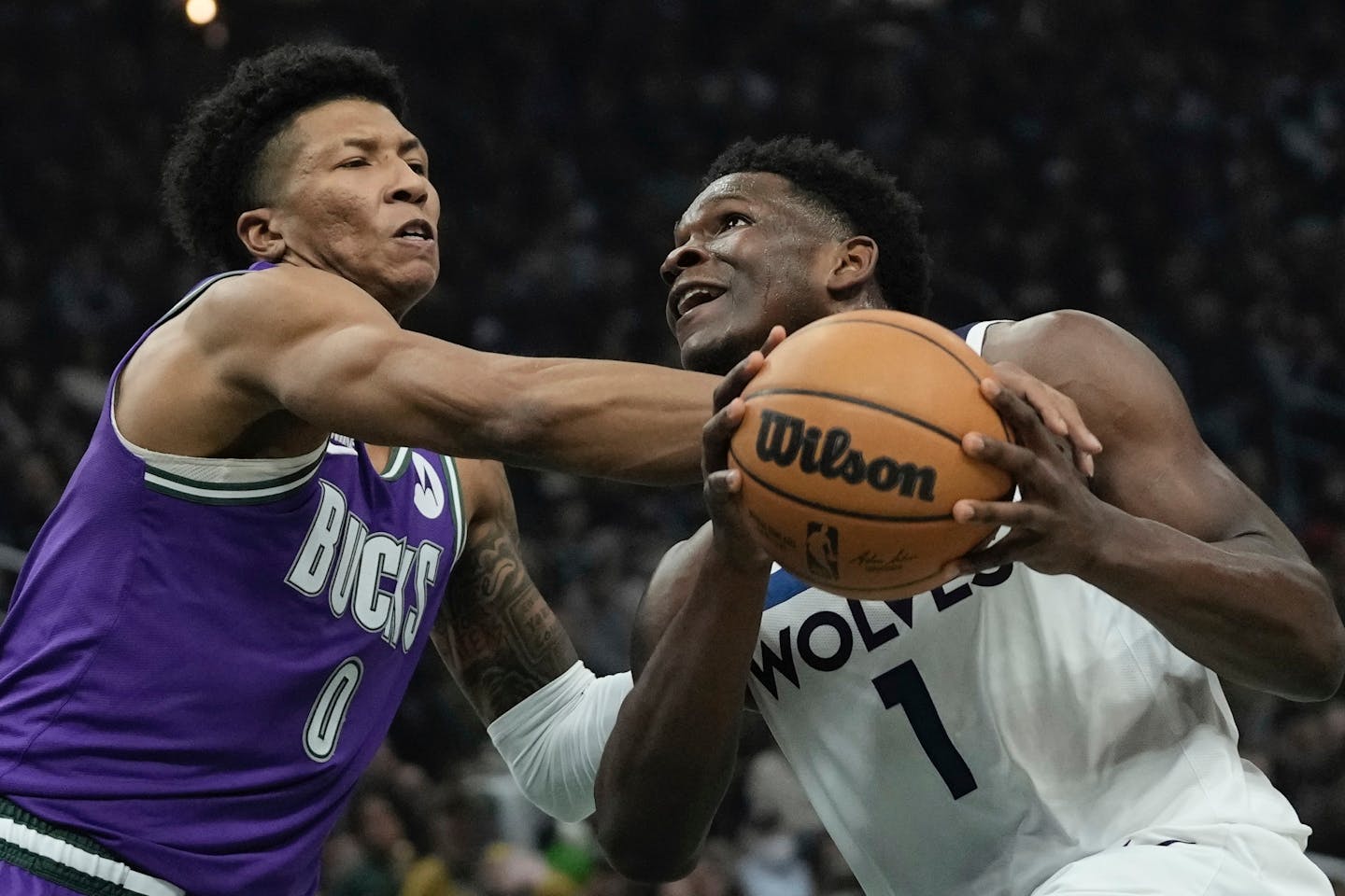 Milwaukee Bucks' MarJon Beauchamp fouls Minnesota Timberwolves' Anthony Edwards during the first half of an NBA basketball game Friday, Dec. 30, 2022, in Milwaukee. (AP Photo/Morry Gash)