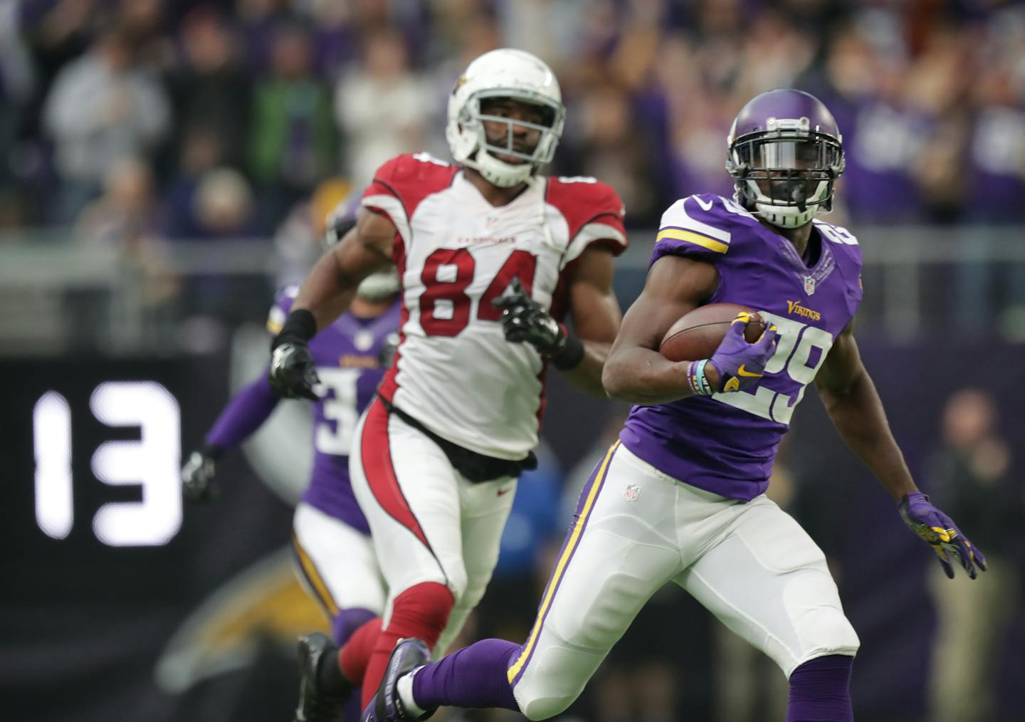 Vikings Xavier Rhodes runs past Cardinals Jermaine Gresham after intercepting a Carson Palmers pass and running it back 100 yards for the TD in the 2nd quarter.