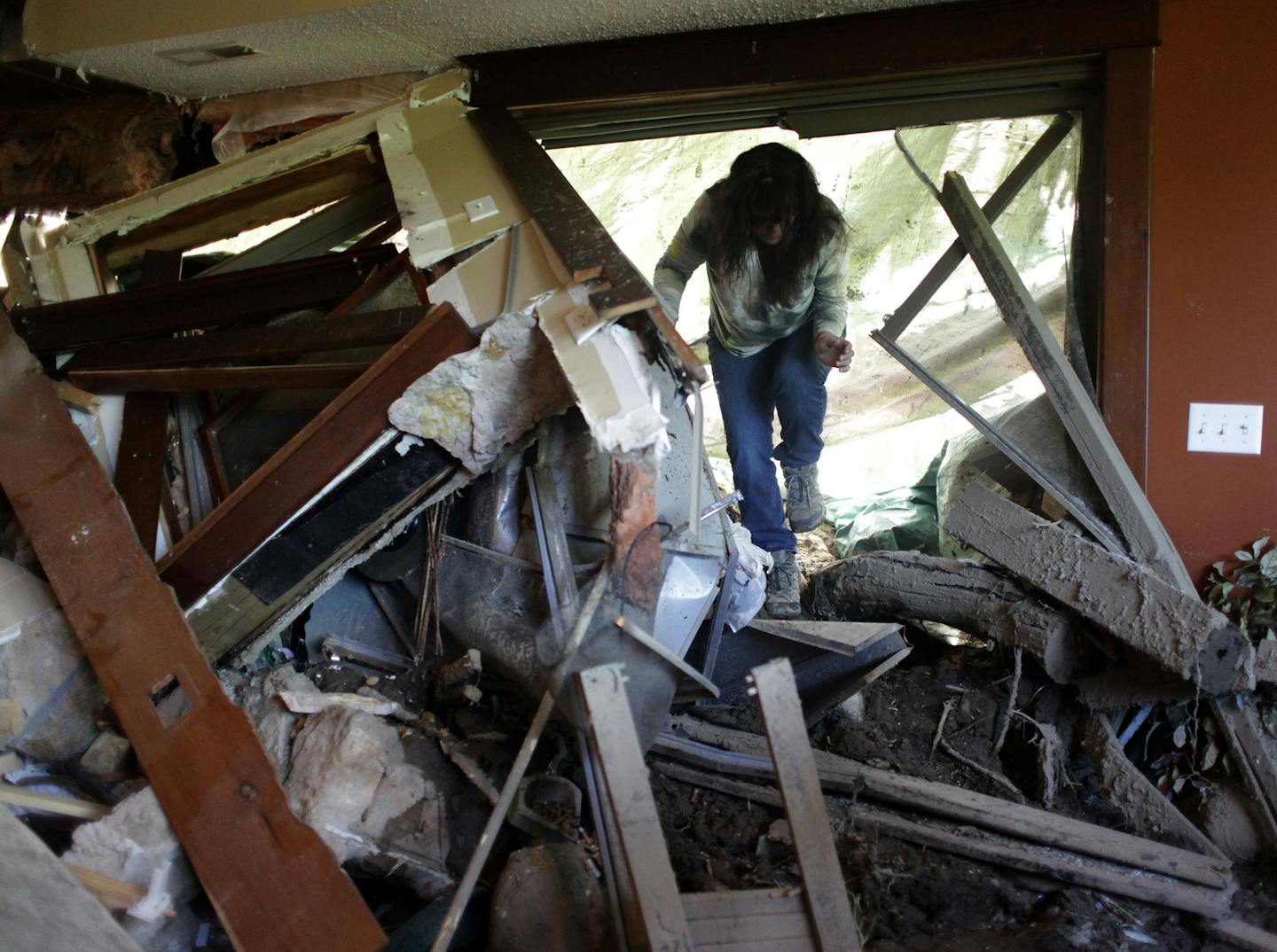 Two weeks ago, a mudslide slammed into the historic Jordan Brewery building. Barbara Lee, one of the owners, explored the damaged apartment on the top floor.