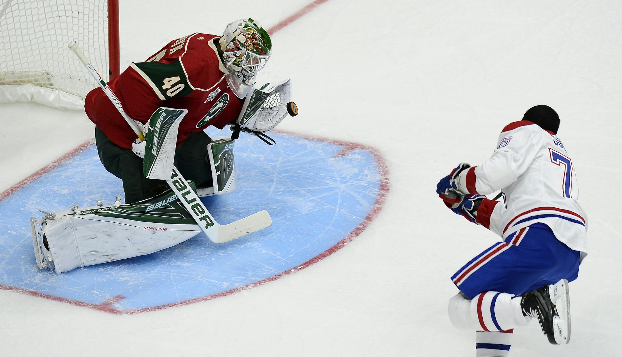 Minnesota Wild goalie Devan Dubnyk (40) stops a shot by Montreal Canadiens defenseman P.K. Subban (76) in the shootout event at the NHL All-Star skills competition Saturday, Jan. 30, 2016, in Nashville, Tenn. (AP Photo/Mark Zaleski)