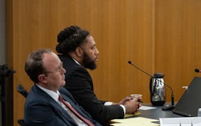 Derrick Thompson listens to testimony from Minnesota State Trooper Andres Guerra on Thursday. Thompson is charged with third-degree murder and multipl