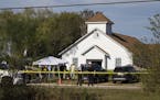 Law enforcement officials works at the scene of a fatal shooting at the First Baptist Church in Sutherland Springs, Texas, on Sunday, Nov. 5, 2017. (N
