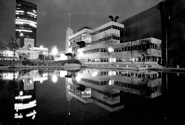 August 20, 1975 A REFLECTING POOL mirrored a panoramic view of the IDS Center, the Foshay Tower and Orchestra Hall from this vantage point at Peavey P