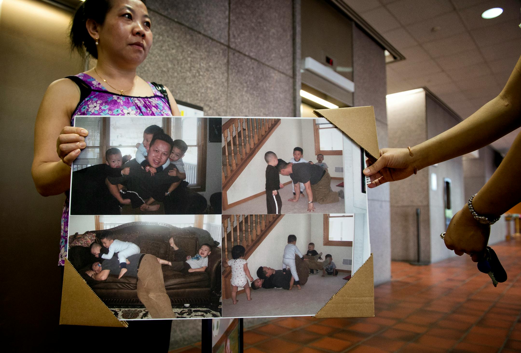 Kao Xiong's family members held photos of him playing with his children to show what a good father he was and how much he loved his children. Kao, whose 4-year-old son shot and killed his little brother with an unsecured handgun, was sentenced Thursday, June 27, 2013, to 10 years probation and 30 days in jail.