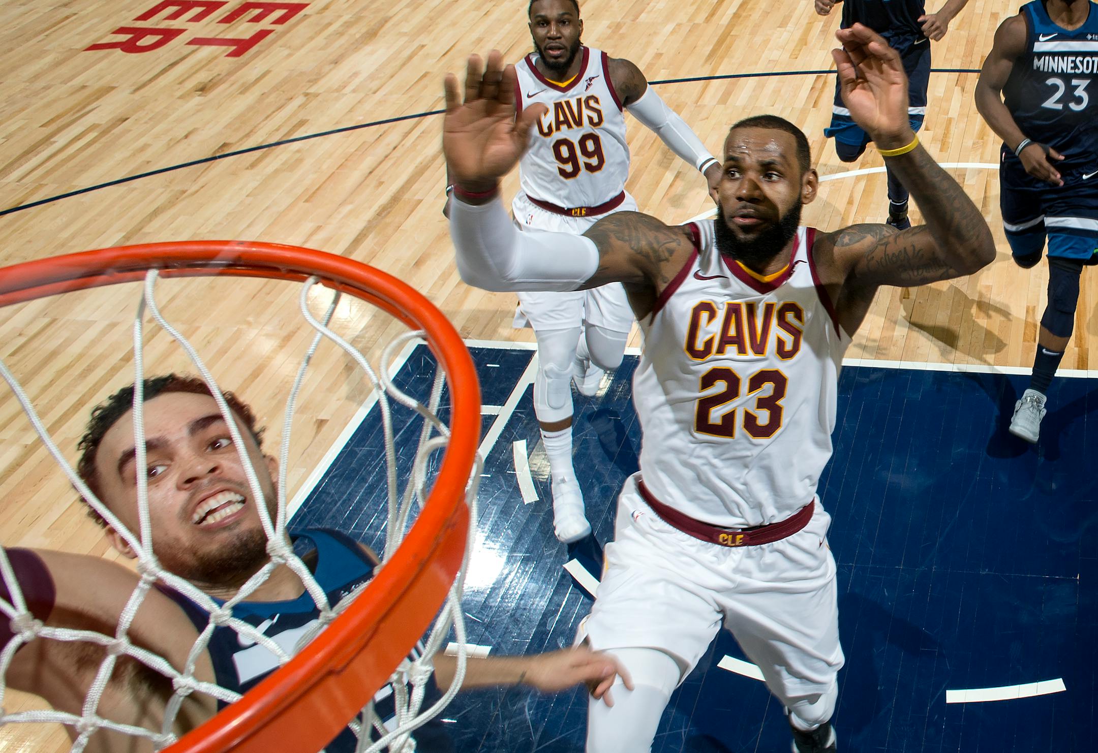 Wolves point guard Tyus Jones dunked the ball while being chased by the Cavaliers' LeBron James on Jan. 8.