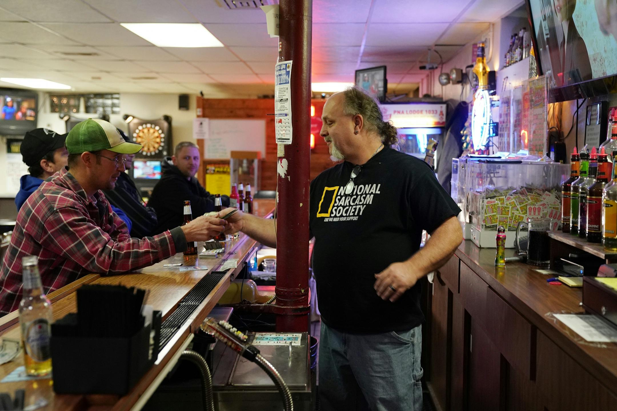Bartender and and the National Polish Alliance outpost president Lonnie Finke talked with regulars during a quiet Thursday night.