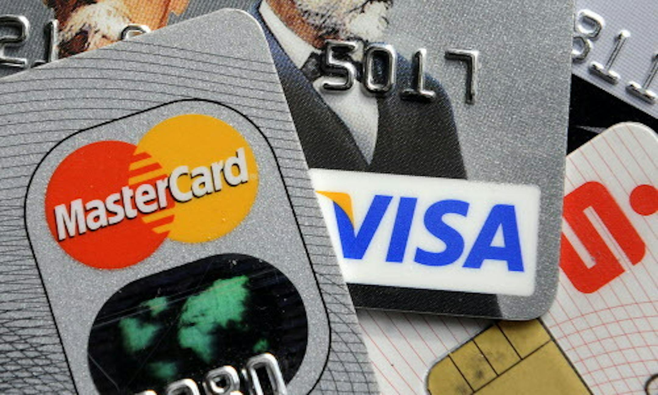 FILE - This Nov. 18, 2009, file photo, shows credit and bank cards. Apple fans who froze their credit after the Equifax data breach may end up with another hassle on their hands if they try to get one of the new iPhones that can cost more than $1,000. People who did so and want to make any big purchase may find the same. (AP Photo/Martin Meissner, File)
