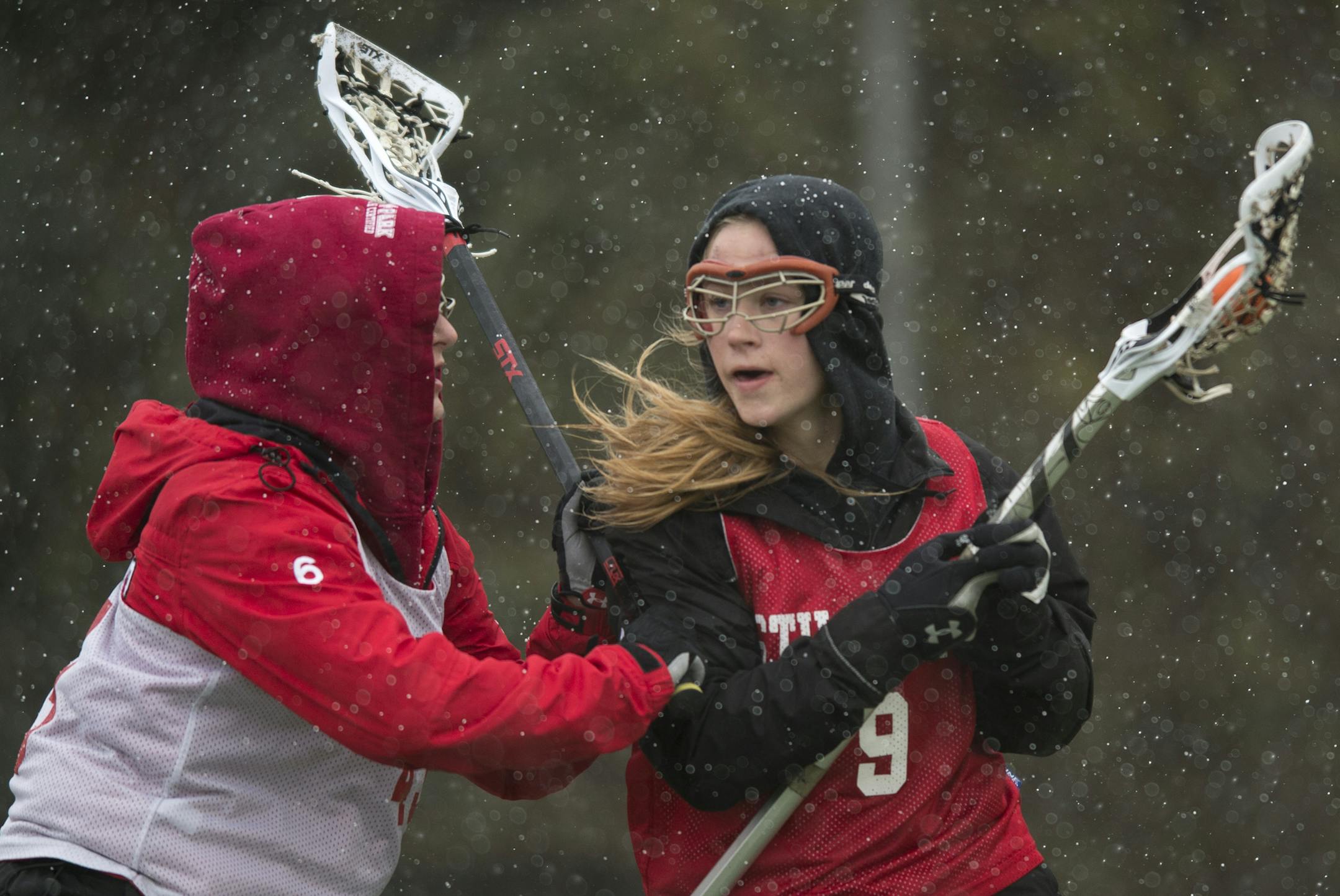 Forward Ashley Ludack, right, moved the ball around defender Ashlyn Jelinek on Tuesday. (Aaron Lavinsky, Star Tribune)