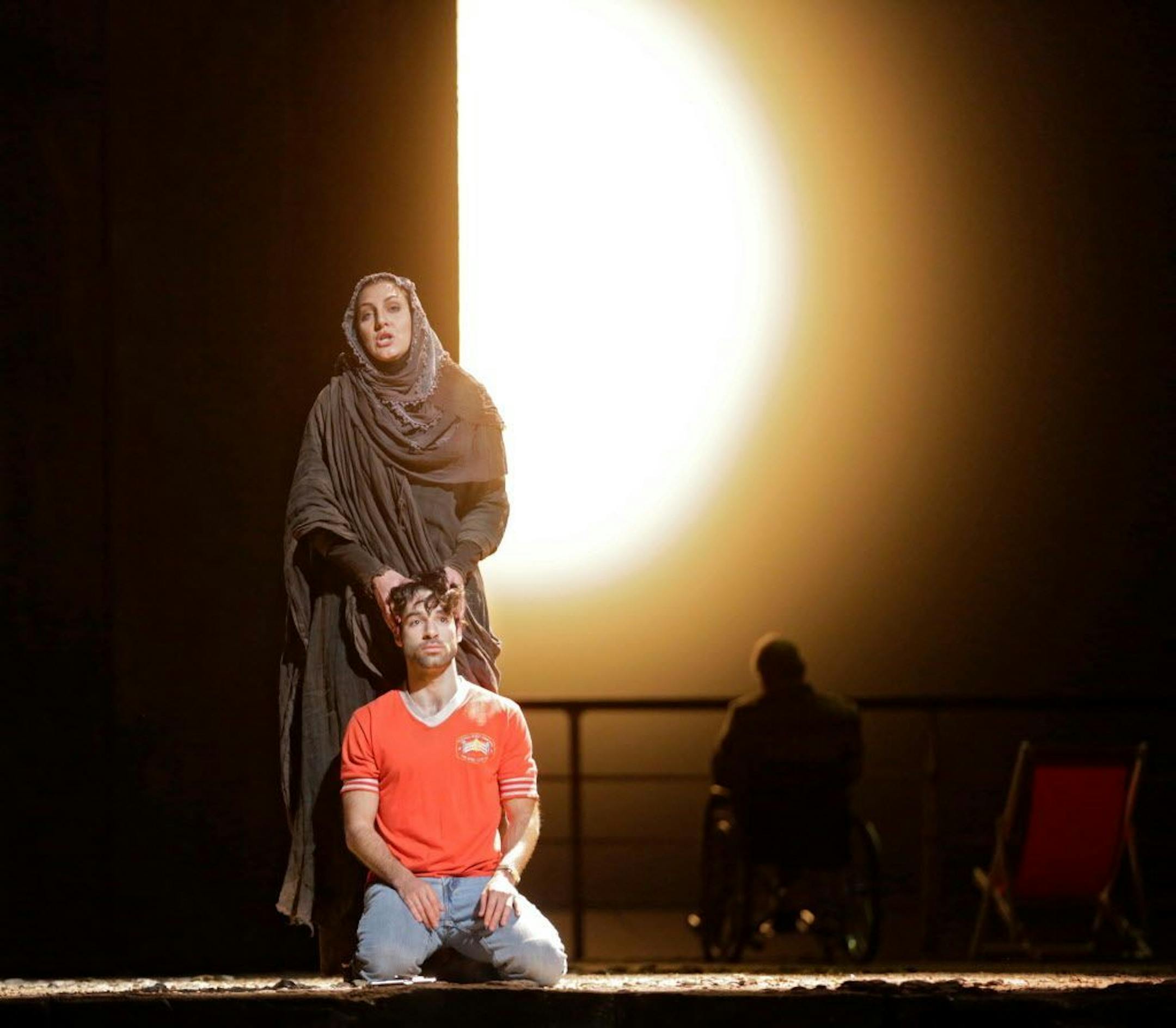 In this image released by the Metropolitan Opera, Maya Lahyani as the Palestinian Woman, standing, and Jesse Kovarsky as Omar, perform in "The Death of Klinghoffer," at the Metropolitan Opera in New York.