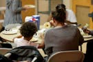 Homeless women and children eat lunch at day shelter The Family Place Thursday, Sept. 19, 2019, in St. Paul, MN.