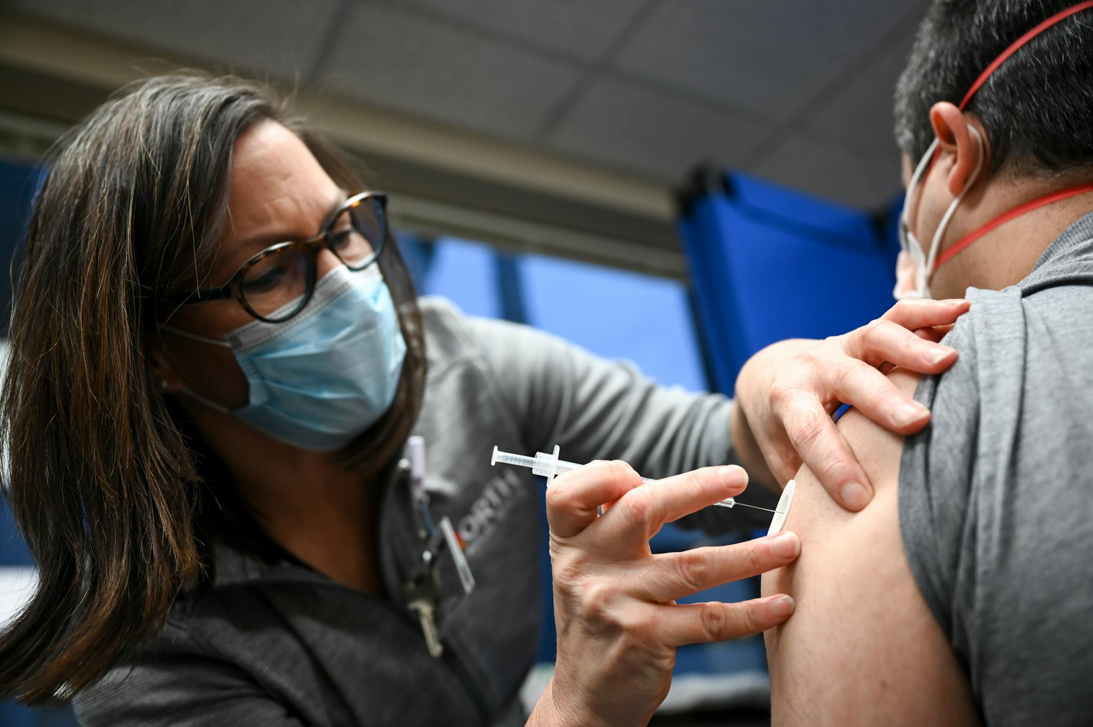 Kari Cline, a nurse and manager with North Memorial Team Member Occupational Health, gave a COVID-19 vaccine dose to a doctor at North Memorial Health Hospital.